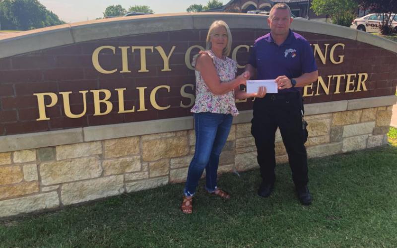 Pictured are Gail Cookerly, Central Community Foundation board member and Franklin Reed, Cushing Emergency Management Director.