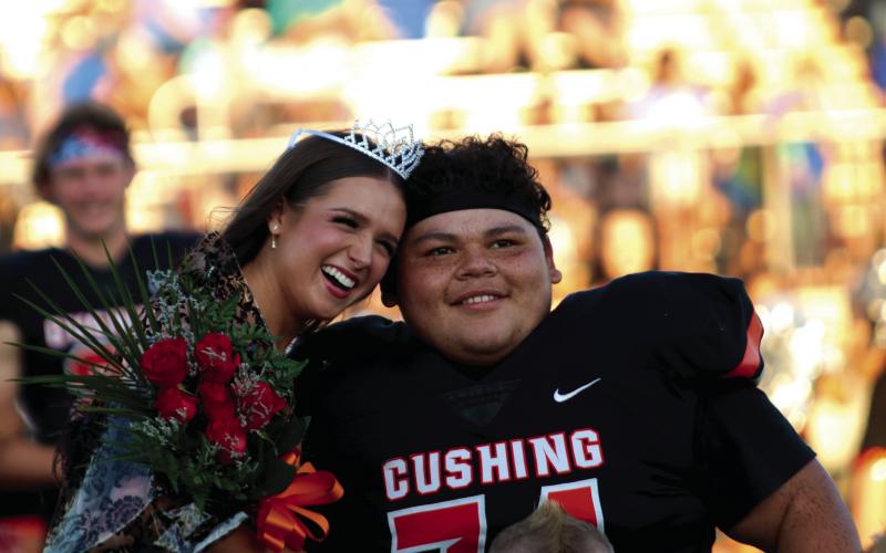 Cushing Homecoming Queen Georgia Griffeth and King Nicholas “Panda” Flores enjoy their moment during homecoming festivities held Friday, prior to the Tiger’s rout of Berryhill, at O’Dell Field. Photo by J. D. Meisner