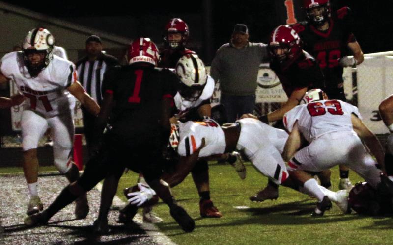 Noah Jones muscles the ball over the goal line for his fourth TD of the night against Skiatook. Jones had 114 yards rushing. Photos by J. D. Meisner.