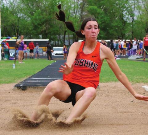 Kamryn James shows winning form in the long jump.