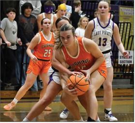 Gracyn Presley battles to maintain possession under the rim. The Cushing Lady Tigers are struggling this season with a record of 2-11.