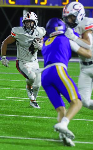 Senior Kellen Fry runs past Pirate defenders.