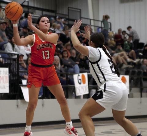 Ella Nanaeto fires a pass inside against the Perkins-Tryon lady Demons last week. Photo by Amber Fausto