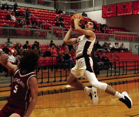 Kanaan Guerrero makes a transition layup. Photo by J.D. Meisner.