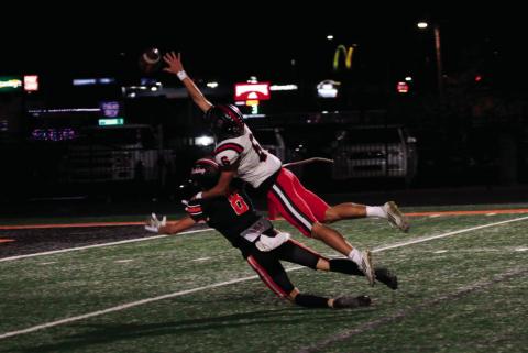 This is what interference looks like as Hilldale free safety Aidan Lindquist takes a ride on the back of Cushing receiver Jordan Kersey. Photo by J. D. Meisner