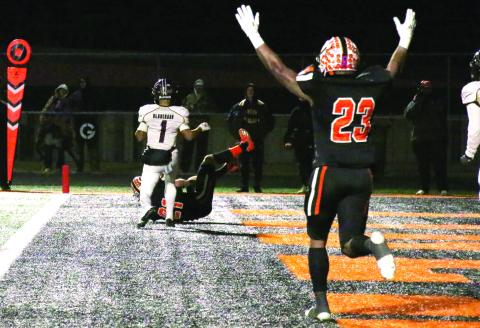 Senior running back Noah Jones celebrates as wide receiver Camden Crooks rolls in with a touchdown during the Tigers’ Friday night win over Blanchard. Cushing advanced to the semi finals and will play the Elk City Elks Friday, at 7 p.m., at the Putnam City High School stadium in Oklahoma City. Photo by Allie Prater. See story inside.