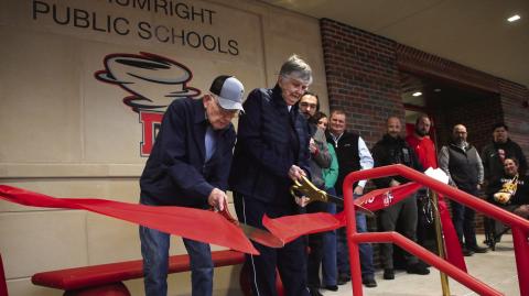 Coach Otis Stump and Dr. Virginia Peters cut the ribbon to open the new Activity Center at Drumright High School, Jan. 29. Photo by Allie Prater