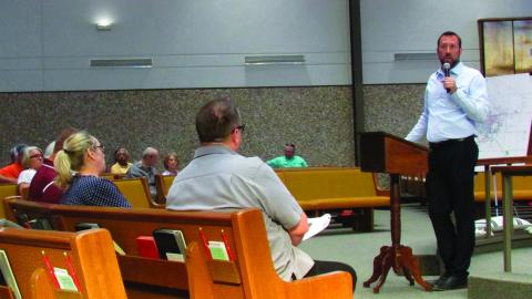 City of Cushing Chairman B.J. Roberson gives a presentation on the financial stability of the city before opening the town hall meeting on June 13 to questions. Photo by DeAnna Maddox