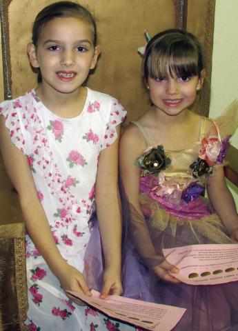 Addie Fox and Mia Fox sit upon a golden throne dressed in their best garb while participating in the Cushing Public Library’s annual Tolkien Week event, the Hobbit Party. Participants earned tickets to the party by following riddles and clues in relation to the J.R.R. Tolkien written series that follows the adventures of Bilbo Baggins. More on page 10. Photo by DeAnna Maddox