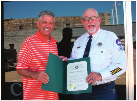 Oklahoma Representative John Talley presents Bob Lynch with a Citation of Recognition for 50 Years of Service.