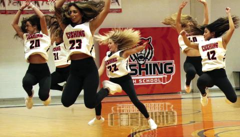 Members off the CHS Tiger dance team catch air as they perform during half time of the Lady Tigers game against the Bristow Pirates, Friday. Photo by J. D. Meisner