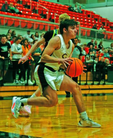 John Hilligos pulls up at the baseline in the Tigers’ 58-49 win over Woodward last week. Photos by Amber Fausto