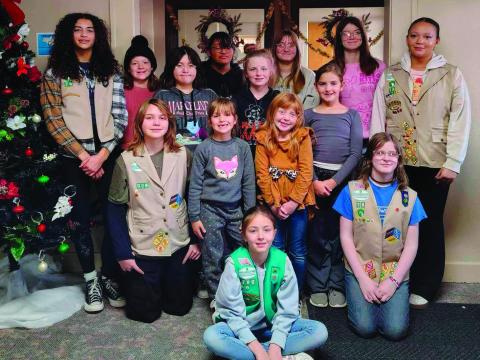 Troop #79 stand together after working diligently to spread Christmas cheer by decorating the Cushing Marketplace. Pictured: back row (L to R): Audrey Roberson, Sadie Maxwell, Tegan Fincher, Arhyanna Tusler, Willow Keyes. Middle row (L to R): Brooklynn Pierce, Teagan Williams, Addilyn Fox, Alexa Page. 3rd row (L to R): Addison Kidder, Mia Fox, Cora Doak, Alice Green. Front: Everley Ewy. Photo courtesy of Laura Green.