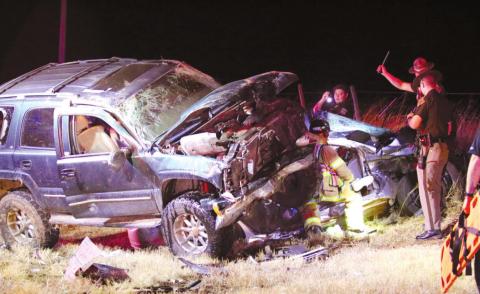 First responders work to free a 16 year old boy from a two vehicle wreck near Stillwater that left one injured and one in critical condition. Photo by Ashlynd Huff man Stillwater News Press