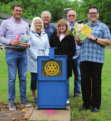 Cushing Rotarians Matt Turner, Nancy Dowell, Tyson Branyan, Tonya Rhoten, Dale Dowell and Cushing City Librarian Michael Haynes surround a new remote library