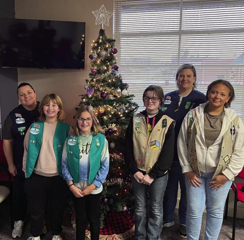 Girl Scout Troop 790 went to the Cushing Marketplace last Sunday on Nov. 30 to decorate for Christmas. Pictured in back is Troop Leader Laura Green and Co-Leader Karen Schmitt-Page. Troop members pictured from left are Vivian Richard, Addison Fox, Alice Green, and Alexa Page. Other members who helped with the recent donation drive but was unable to decorate are Sadie Maxwell, Arhyanna Tusler, Rhylynn Garcia, Teresalynn Parson, and Brooklyn Pierce.