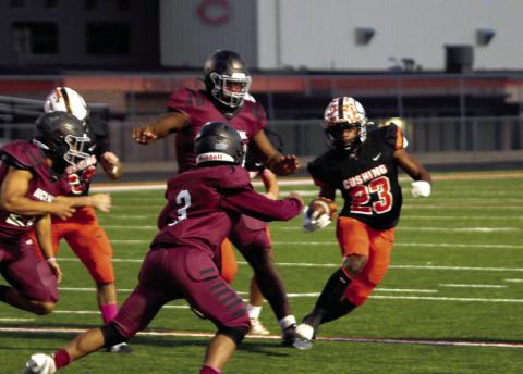 Runningback Noah Jones hits the brakes in an effort to shrug off a McClain defender Friday. Jones had 72 yards on 11 carries and scored two touchdowns. Photos by J.D. Meisner.