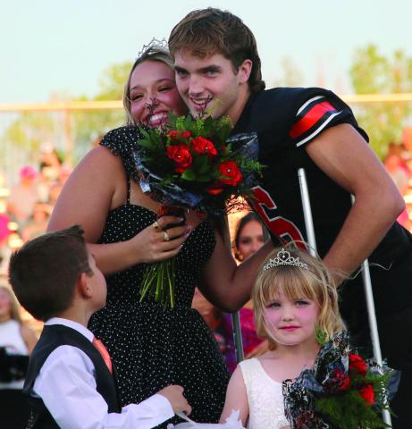 Max Wood and Maddie Collier celebrate after being crowned 2024 Cushing Tiger Homecoming King and Queen during homecoming festivities Friday night while crown bearer Kannon Fowler and flower girl Landry Morgan look on. Photo by Allie Prater. More photos page 12.