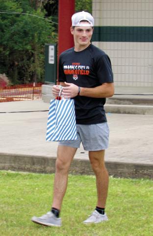 Pictured is the 5K Grappler’s Gallop overall winner in the male division — Brady Matheson who had a time of 18:26. Overall Female winner was Marlee Myers with 23:12. Youngest participant was Kolter Simpson and oldest was Phil Kenkel. Photo by DeAnna Maddox