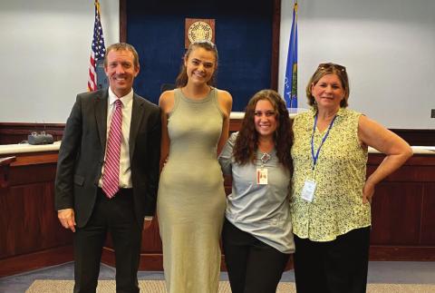 Payne County Judge Michael Kulling swears in CASA volunteers Paige Marttindale, Kylie Hager &amp; Marie Russell.