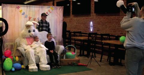 The Hamm siblings, Wyatt, Gage, and baby Ava, ham it up for their photo with the easter bunny during the Gibble Easter Festival Saturday, April 19. Photo by Allie Prater