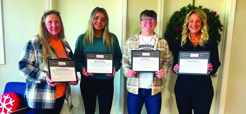 Cushing Chamber of Commerce President and CEO Tracy Caulfield celebrated the chamber’s “Business After School, November honorees Monday with a reception in their honor. Selected for the Month of November were, from left, Teacher of the Month Brandi Brichacek, Cushing Middle School science teacher; Student of the Month Gabriella Craig, Student of there Month Carl Peterson; and Support Employee of the month Rachael Simpson, Cushing Upper Elementary teaching assistant. Photo by J. D. Meisner
