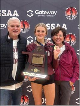 Bill and Jo Ahrberg stand with their granddaughter, Edmond Memorial Freshman Audrey-Kate Bajema, after she and her team captured the OSSAA Class 6A state volleyball title last month.