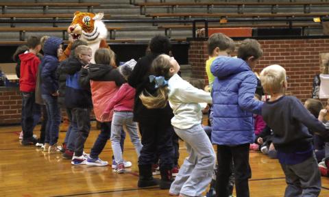 Cushing second graders do the “cobweb shimmy” with Tony the Tiger during P.E. on Tuesday, Oct. 31. Photos by Allie Prater