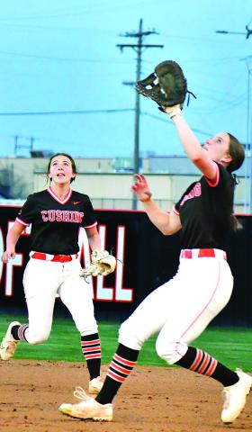 Macy Griffith handles an infield fly at first base for the 16thranked, 10-9, Lady Tigers while Laramie McCoy backs her up. Photos by Sarah Townes