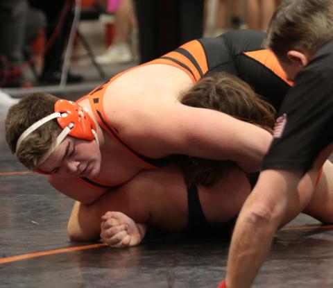 Tiger Aaron Vieyra pins Landon Schroeder of Kingfisher. photo by J. D. Meisner