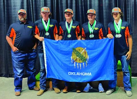 From left to right: Coach Dewayne Skidgel, Alexander Palmer, Tanner Moles, Evan Beck and Tagun Fittje.