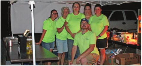 Members of ACE at the concession during outdoor movie night in Agra. Brandi Gladden, Brenda Bottger, Becky Seller, Laura Brown, Kimberly Sweet, and Justin Brown