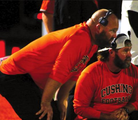 Coaches Rusty Morgan and J Moore discuss strategy Friday.