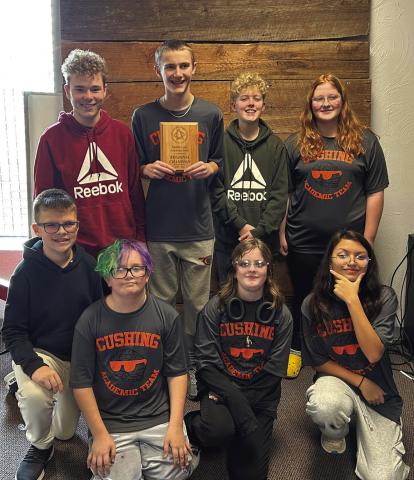 Last week Cushing Middle School Academic Team competed in Regionals and won. Pictured is the team with the plaque they received following the competition. Courtesy of Cushing Public Schools