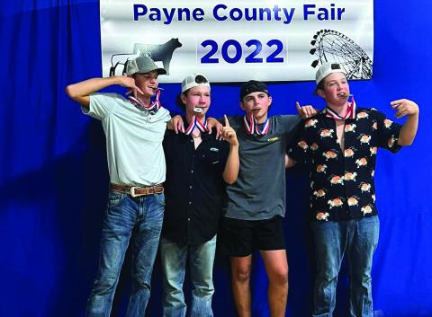 Pictured are the Cushing FFA members who took home first place in the Farmhand Olympics during the Payne County Fair held last week from Aug. 22 to Aug. 27— Khyler Simon, Clay McKiddy, Kale Robinson and Korben Gaskins