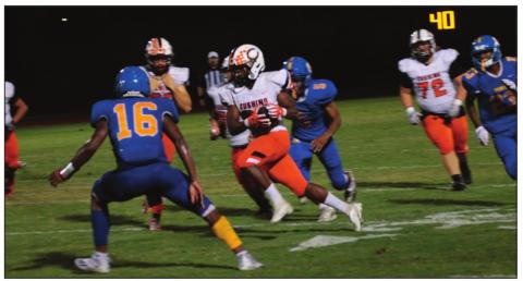 Tiger speedster Noah Jones slices through Classes linebackers on his way to a 100-plus yard running game.