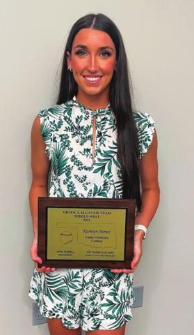 Kamryn James stands with her OHSFSCA All-State team Utility-Outfielder award for class 3 and 4A.