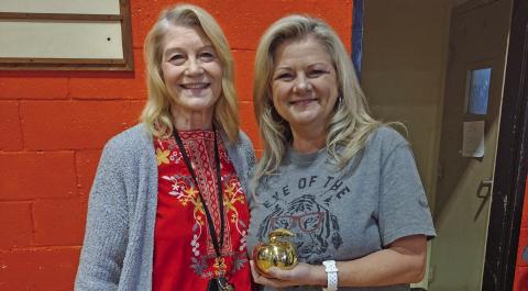 Agra Public School’s third grade teacher Vickie Weigel was announced as the 2025 District Teacher of the Year during the monthly assembly held on Monday, May 5. Pictured is Superintendent Dr. Anita Watkins with Weigel holding the golden apple she was presented with. Watkins explained Weigel was selected by her peers to receive the recognition. Photo by DeAnna Maddox