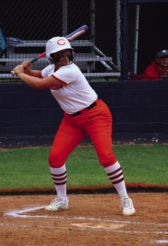 Lady Tiger Ava Hebensberger gets ready to wind up on a pitch and launch another shot over the left field wall… her favorite spot. Photo by Sylvia Danyele