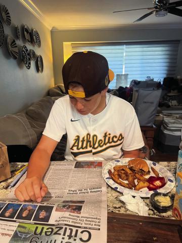 Roland Williams, 10, of Roseville, CA, reads the Cushing Citizen as he eats his lunch. Share with us on Facebook how you read your Cushing Citizen!
