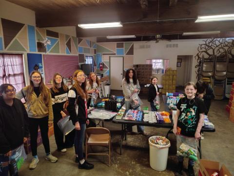 Troop #79 members who were present to package hygiene bags were Tegan Fincher, Kira Keyes, Willow Keyes, Bella Keyes, Rhylynn Garcia, Aubrey Roberson, Everley Ewy, Alice Green, and Brooklyn Pierce. Additionally, Arhyanna User, Alexa Page, Addilyn Fox, Addison Kidder, Sadie Maxwell, Teagan Williams, Vaeda Nugent, and Vivian Richard also contributed items to be donated but were unable to attend the packing party.