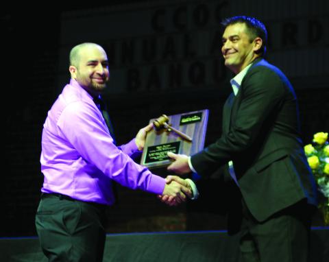 Nick Naifeh, incoming President of the Cushing Chamber of Commerce Board for Directors shakes hands with Matt Turner, outgoing president.