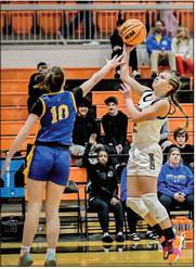 CHS freshman Macie Townes goes up from the paint over Berryhill freshman Leighton Inhofe. Photo by Sarah Townes