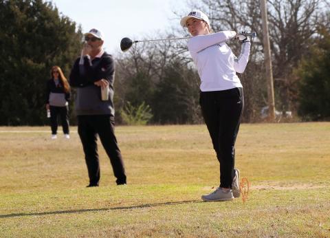 Lady Tiger sophomore Ashlyn Floyd hits a drive to the green during Monday’s tournament. Photo by Allie Prater.