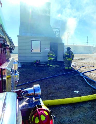 Cushing firefighters Tyler Morris and Dalton Armstrong participate in a recent in-service day where members of the department were trained on how to utilize the newly-christened fire training tower. Then tower was manufactured by Fire Facilities, Inc.