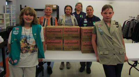Pictured are Troop members Vivian Richard, Alexa Page, and Teresalyn Parson alongside Troop leaders Karen Schmitt-Page and Laura Green and Cushing Middle School staff member Missy Hogrefe with several boxes of Girl Scout Cookes the troop members decided to donate to the Cushing Middle School food pantry. Additional troop members who were involved in the donation but were unable to be present were Hannah Toops, Sadie Maxwell, Addilyn Fox, Arhyanna Tusler, and Samantha Cantrell. Photos by DeAnna Maddox