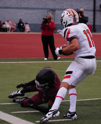 Brady Matheson fights his way toward the endzone Thursday. Photos by Cindy Waylan
