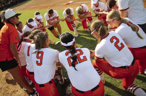 The Cushing Lady Tigers circle up for a pregame pep talk from Lady Tiger Head Coach Nikki York before the Lady Tigers took on the Davenport Lady Bulldogs in the season opener Monday, Aug. 10. See inside for more details. Photo by Allie Prater.