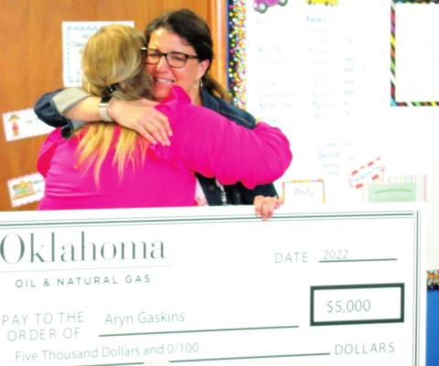 Cushing Lower Elementary teacher Aryn Gaskins hugs Jodie Shupe, the parent who nominated Gaskins for Oklahoma Energy Resources Board’s Top Ten Teachers of 2022. Gaskin’s was awarded $5,000 from Oklahoma Oil &amp; Natural Gas and the district received $2,000. See story inside.