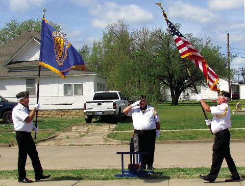 The color guard posted the American Legion and United States flag side by side at the commencement of the commemoration event that was hosted by Post 108 this past Saturday on March 29. Photo by DeAnna Maddox
